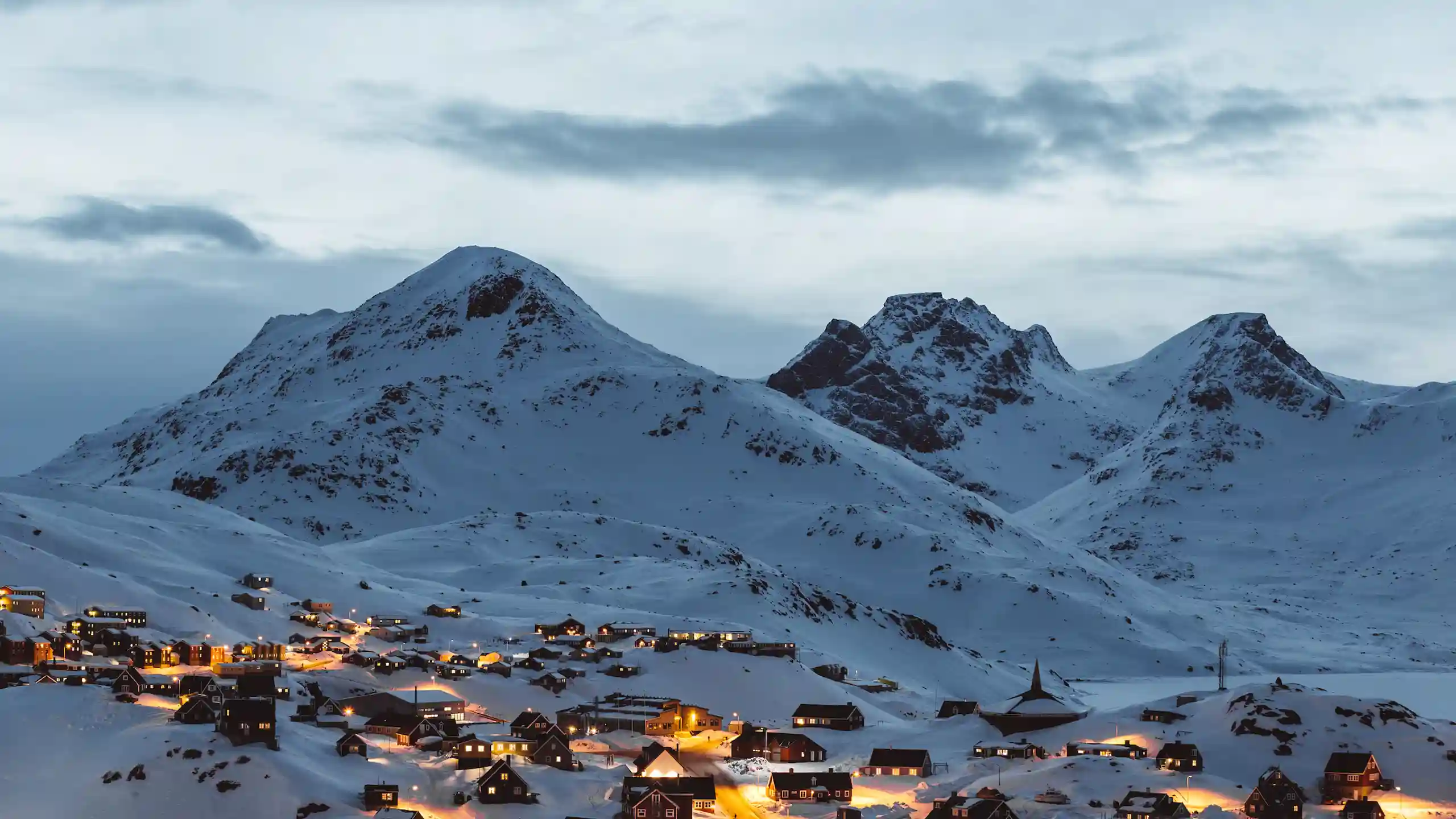 House Lights Illuminating Tasiilaq. Photo Nikolaus Brinkmann , Visit Greenland