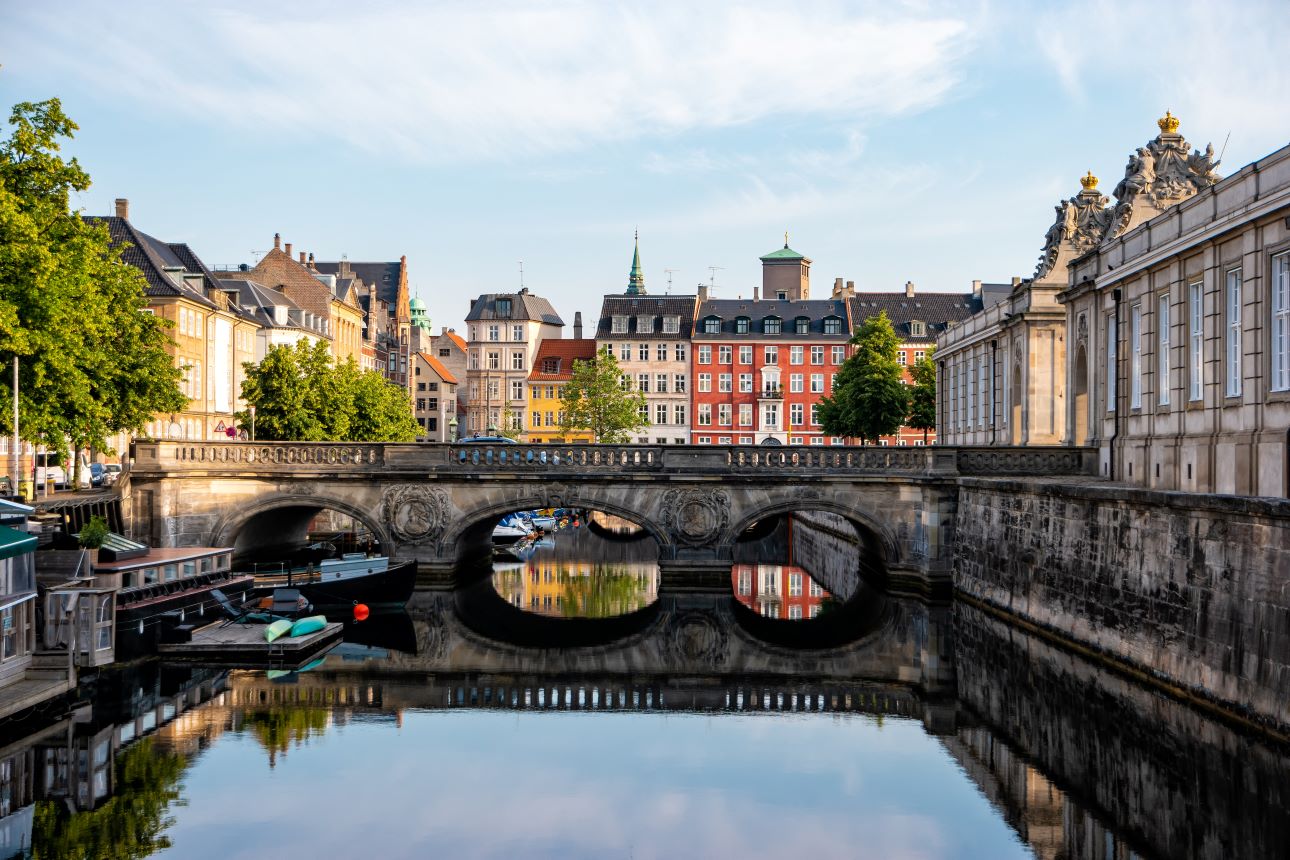 Copenhagen, Denmark. View Of Old Marmorbroen Or Marble Bridge With The Reflection. The Historical Center Of The Danish Capital.