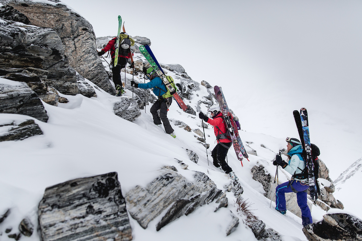 Skiers Climbing Towards Tasiilaq Mountain Hut In East Greenland